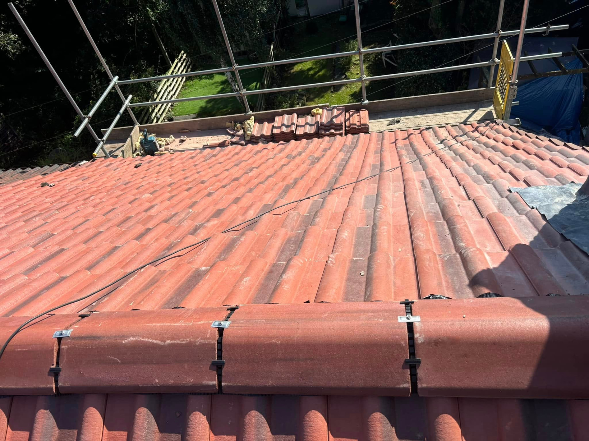 Roof re-covered with new ridge and clips fitted