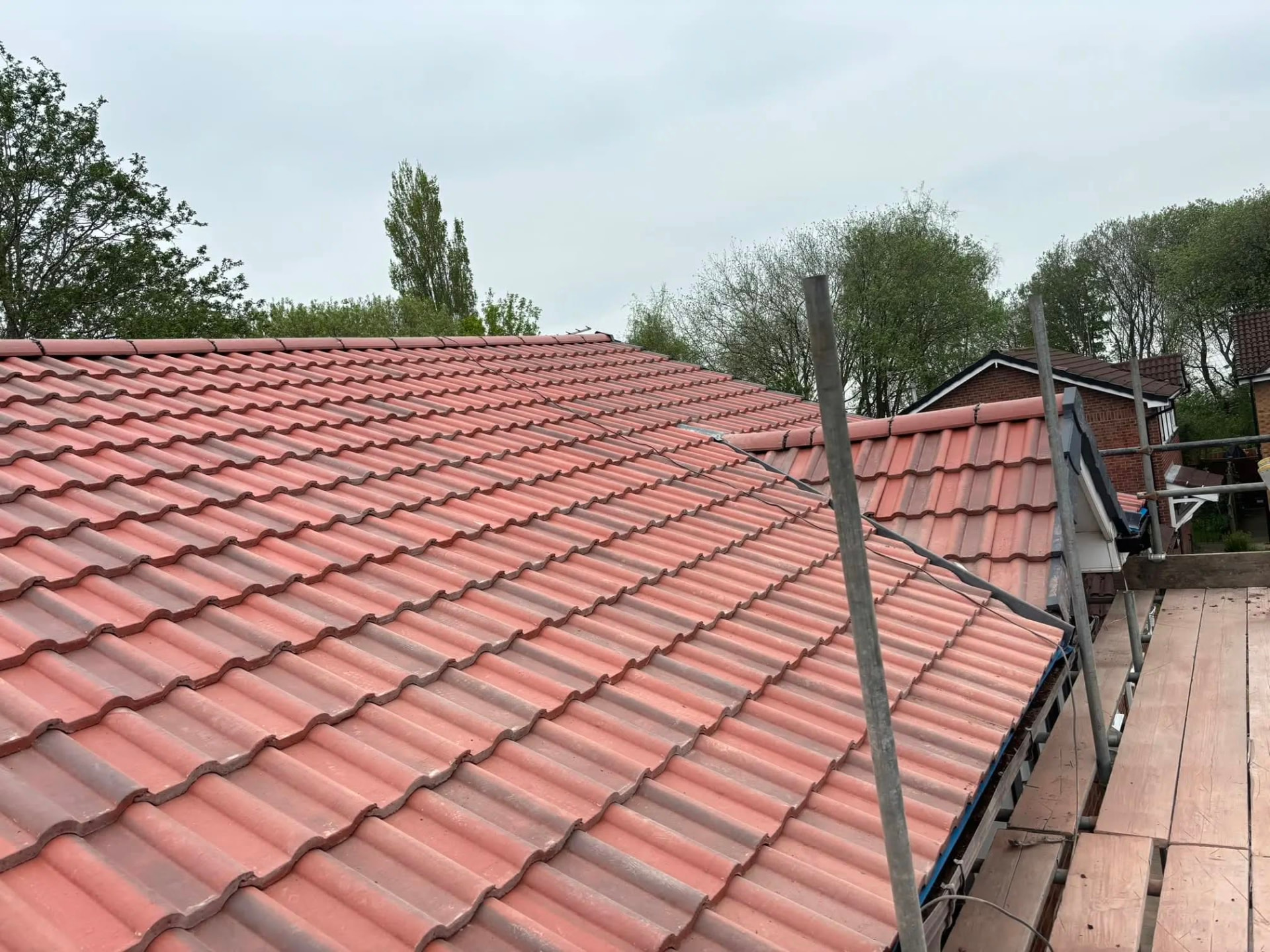 Freshly finished tiled roof seen from the scaffold