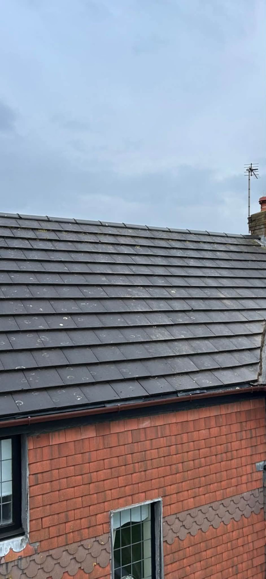 Slate roof with new leadwork and black roofline